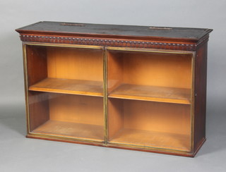 A William IV mahogany display cabinet with moulded cornice, fitted shelves enclosed by a pair of gilt metal hinged doors 77cm h x 125cm w x 37cm with Bramah locks 