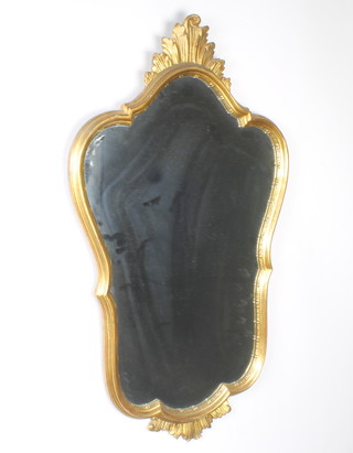 An Italian bevelled plate mirror contained in a gilt carved wood frame 89cm x 52cm 