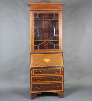 An Edwardian inlaid mahogany bureau bookcase, the upper section with moulded cornice the interior fitted adjustable shelves enclosed by astragal glazed panelled doors, the fall front revealing a well fitted interior above 3 long graduated drawers, raised on bracket feet 196cm h x 69cm w x 40cm d 