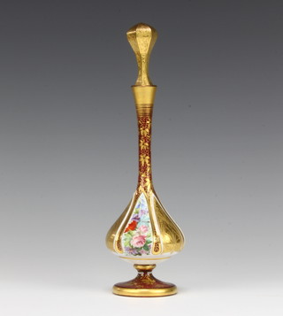 A 19th Century Bohemian baluster flask with tapered neck decorated with panels of spring flowers, having a waisted stopper 27cm 