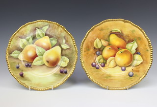 A pair of Coalport dessert plates decorated with fruits by R Dale and M Dennis 27cm 