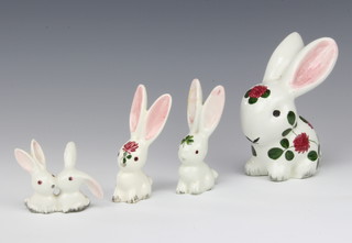 A Plichta rabbit with floral decoration 12cm and three others, 10cm and 6cm