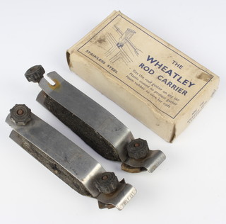 A pair of Hardy Bros. rod holders together with a pair of Wheatley rod holders, boxed