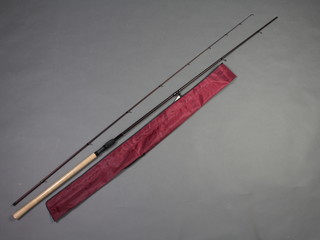 A Dremman 11' carp fishing rod contained in original bag 