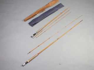 A 2 piece 8' split cane fly fishing rod together with a 3 piece split cane fly rod, both in cloth bags 