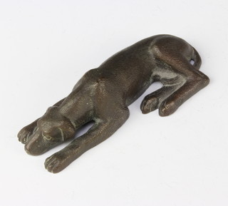 A bronze figure of a reclining dog 11cm 
