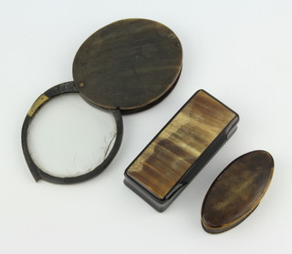 A 19th Century rectangular horn snuff box 2cm x 8cm x 3cm, an oval horn trinket box 2cm x 5cm x 3cm, a magnifying glass contained in a horn frame 8cm (glass chipped) 