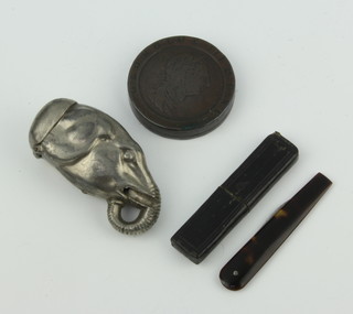 A trinket box formed from a George III cart wheel penny, a 19th Century metal vesta case in the form of an elephants head 5cm (tusks missing), together with Harveys of London a 19th Century bloodletting knife with "tortoiseshell" grip 
