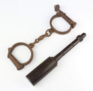 Hiatt, a pair of 19th Century iron handcuffs complete with key together with a turned wooden tip staff/priest 23cm 