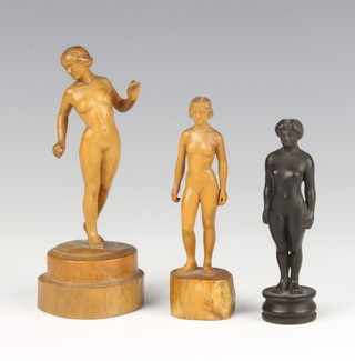 R Flint, a carved wooden figure of a standing naked lady, raised on a turned base 11cm and 2 others 10cm and 9cm 
