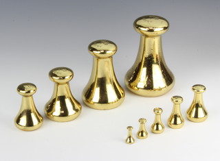 Nine brass bell weights marked Avery Croydon - 7lbs, 4lbs, 2lbs, 1lb, 8 ozs, 4 ozs, 2 ozs, 1 ozs and 1/2 oz 