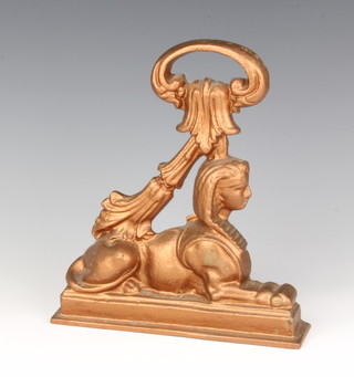 A 19th Century cast iron door stop in the form of a sphinx 24cm x 21cm x 5cm 