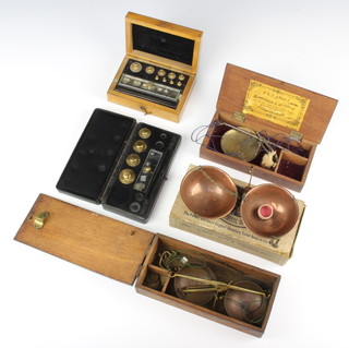 A set of 19th Century polished steel and brass scales contained in a mahogany case, lid marked T Avery and 1 other set of steel and copper scales marked W T Avery patent and  2 boxes containing a collection of weights 
