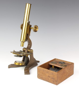 A brass single pillar microscope and 3 lenses 
