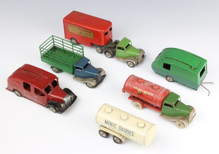 A Triang Minic tinplate caravan M41, ditto M31 mechanical hose and fuel oil tanker, a 67M farm lorry, M62 fire engine (ladders missing, no key and tyres  perished), a clockwork transport lorry and a Minic dairy tanker 