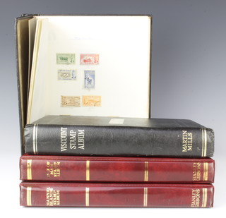 Two black Viscount albums of George VI and later  Ascension Islands, Falkland Islands and Jersey mint and used stamps and 2 Stanley Gibbons albums of Isle of Man stamps 