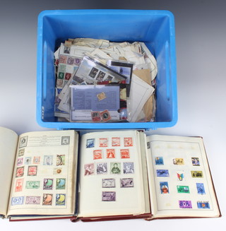 Two  albums of world stamps - Ceylon, Nigeria, Canada, Brazil, Australia, Switzerland, Sweden, South Africa and a collection of used stamps 