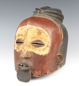 An Eastern carved hardwood and painted mask 34cm x 26cm 