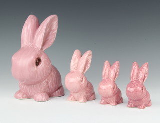 A pink Sylvac rabbit 1027 21cm, a ditto 990 11cm and a pair 106 9cm 
