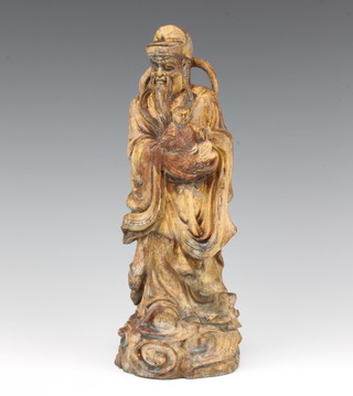 A carved Chinese hardwood figure of a standing deity 28cm x 10cm x 9cm 