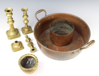 A circular copper preserve pan 38cm, a circular copper mould 11cm, an embossed jardiniere 9cm, a brass candlestick with ejector 23cm, pair of candlesticks (1f) 