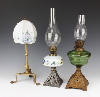 A gilt painted Pulman lamp with glass shade together with 2 Victorian glass oil lamps with pierced iron bases and clear glass chimneys 