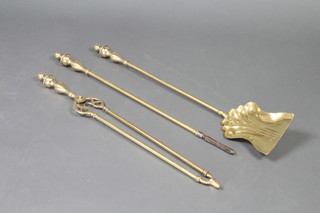 An Adam style brass fireside companion set comprising shovel, poker and tongs 
