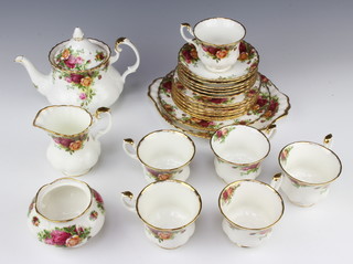 A Royal Albert Old Country Roses tea set comprising teapot, milk jug, sugar bowl, 6 tea cups, 6 saucers, 6 sandwich plates and a cake stand 
