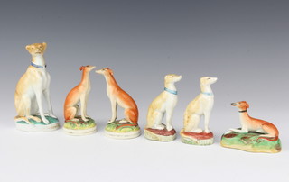A Victorian Staffordshire figure of a seated hound 14cm and 5 others