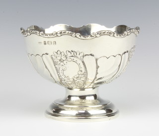 An Edwardian repousse silver pedestal bowl with floral and scroll decoration 10cm, 220 grams 
