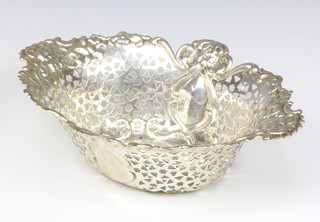 An Edwardian oval pierced and repousse silver dish with floral decoration, Chester 1901, 28cm, 365 grams 