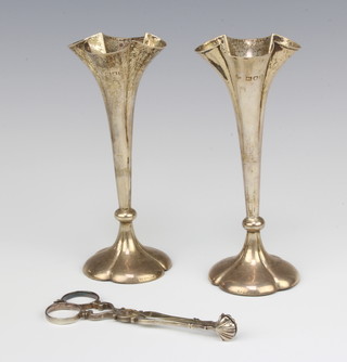 A pair of Edwardian silver tapered posy vases London 1903, 14cm and a pair of Georgian silver sugar nips