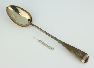 A Victorian silver basting spoon with engraved monogram, London 1877, together with a silver tooth pick, 150 grams 