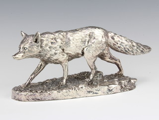 A filled silver model of a walking fox, 24cm 