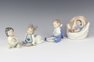 A Nao figure of an infant in cradle 11cm, ditto baby girl with dummy 10cm and 2 figures of seated infants with plate and spoon 9cm  