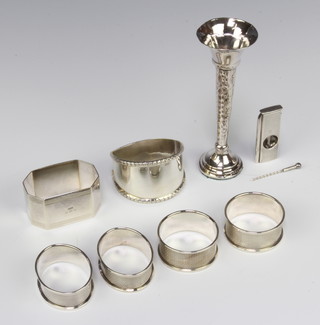 An octagonal silver napkin ring Birmingham 1926 and 5 others, a cigar cutter and posy vase, weighable silver 120 grams 
