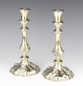 A pair of Georgian style repousse silver plated candlesticks 25cm 