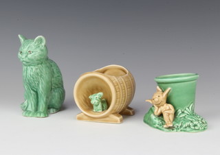 A Sylvac green seated cat 1086 12cm, a ditto pot with a pixie sitting against a flower pot 2278 7cm and a vase in the form of a terrier sitting in a barrel 10cm 
