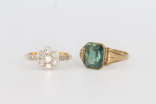 An 18ct  yellow gold diamond cluster ring size J and a yellow gold green stone ring size M 