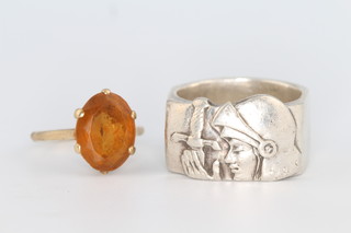 A 9ct yellow gold citrine ring size N and a silver Joan of Arc ring size U 