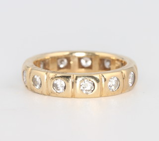 A yellow gold diamond set eternity ring size N 