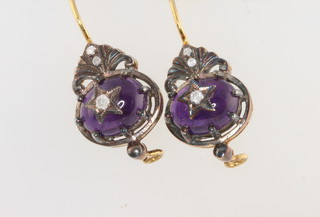 A pair of Edwardian style drop earrings set with cabochon cut amethysts and diamonds 