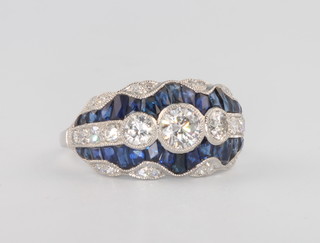 An Edwardian style  platinum, diamond and sapphire dress ring size N