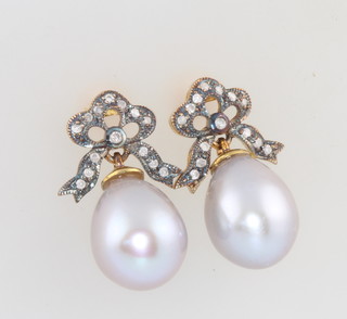 A pair of grey cultured pearl drop earrings set with diamond bow tops 22mm