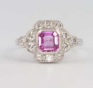 An 18ct white gold pink sapphire and diamond ring, the centre stone approx 1.1ct surrounded by brilliant cut diamonds approx. 1.2ct, size O 