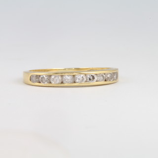 An 18ct yellow gold diamond half eternity ring size K 1/2, gross weight 1.8 grams