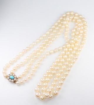 A double strand of cultured pearls with a turquoise and seed pearl 9ct clasp 70cm 