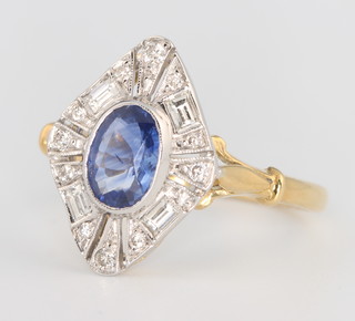 An 18ct white gold sapphire and diamond ring, the oval centre stone approx. 1ct, surrounded by brilliant baguette cut diamonds approx. 0.35ct, size O 1/2