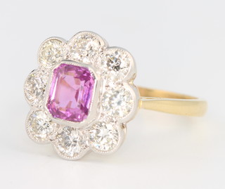 An 18ct yellow gold pink sapphire and diamond cluster ring, the centre stone approx. 1.1ct, surrounded by brilliant cut diamonds 1.2ct, size O 