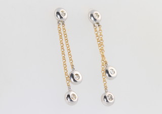 A pair of 18ct yellow and white gold 2 stone diamond earrings 